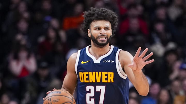 Dec 31, 2025; Toronto, Ontario, CAN; Denver Nuggets guard Jamal Murray (27) dribbles against the Toronto Raptors during the second half at Scotiabank Arena.