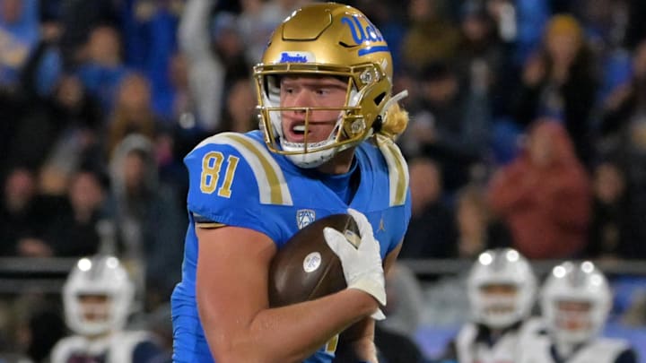 Nov 12, 2022; Pasadena, California, USA;   UCLA Bruins tight end Hudson Habermehl (81) completes a 51 yard pass play and runs into the end zone for a touchdown in the first half against the Arizona Wildcats at the Rose Bowl. Mandatory Credit: Jayne Kamin-Oncea-Imagn Images