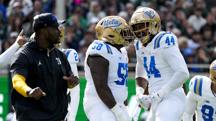 Oct 11, 2025; East Lansing, Michigan, USA; The UCLA Bruins defense celebrates forcing a fumble in the second quarter at Spartan Stadium. Mandatory Credit: Brendan Mullin-Imagn Images Oct 11, 2025; East Lansing, Michigan, USA; The UCLA Bruins defense celebrates forcing a fumble in the second quarter at Spartan Stadium. Mandatory Credit: Brendan Mullin-Imagn Images