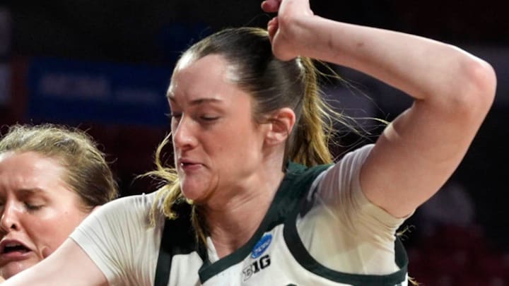 Michigan State Spartans forward Grace Vanslooten (14) reaches for the ball beside Colorado State Rams guard Kloe Froebe (1) during a first-round game in the NCAA women's basketball tournament between the Colorado State Rams and the Michigan State Spartans at Lloyd Noble Center in Norman, Okla., Friday, March 20, 2026.