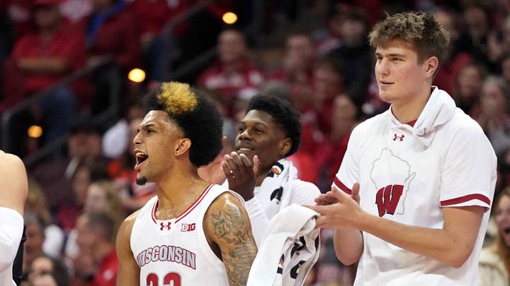 Jan 19, 2024; Madison, Wisconsin, USA; The Wisconsin Badgers bench, from left, Wisconsin Badgers forward Tyler Wahl (5), Wisconsin Badgers guard Chucky Hepburn (23) and Wisconsin Badgers forward Nolan Winter (31) celebrate a three point basket made by Wisconsin Badgers guard Max Klesmit (11) against the Indiana Hoosiers during the second half at the Kohl Center. Mandatory Credit: Kayla Wolf-USA TODAY Sports