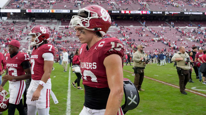 Oklahoma quarterback John Mateer walks off the field after the Sooners' 34-26 loss to Ole Miss on Saturday.