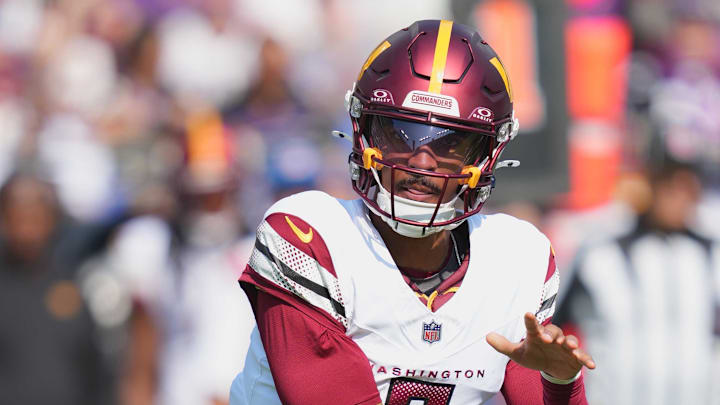 Oct 13, 2024; Baltimore, Maryland, USA; Washington Commanders quarterback Jayden Daniels (5) throws a first quarter pass against the Baltimore Ravens at M&T Bank Stadium. Mandatory Credit: Mitch Stringer-Imagn Images