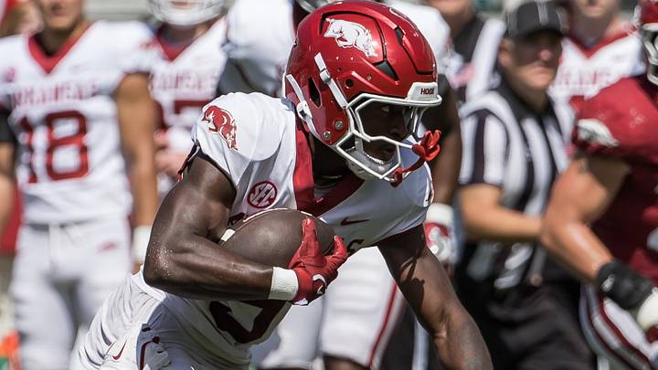 Arkansas Razorbacks wide receiver Jamari Hawkins (9) tries to escape the grasp of defensive back Nsongbeh Ginyui (15) during the spring game at Razorback Stadium. Arkansas Razorbacks wide receiver Jamari Hawkins (9) tries to escape the grasp of defensive back Nsongbeh Ginyui (15) during the spring game at Razorback Stadium.