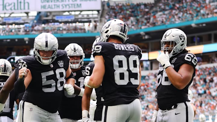 Nov 17, 2024; Miami Gardens, Florida, USA; Las Vegas Raiders tight end Brock Bowers (89) celebrates with guard Jackson Powers-Johnson (58) after scoring a touchdown against the Miami Dolphins during the third quarter at Hard Rock Stadium. Mandatory Credit: Sam Navarro-Imagn Images