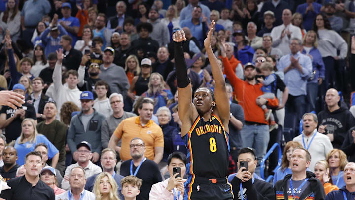 Mar 9, 2025; Oklahoma City, Oklahoma, USA; Oklahoma City Thunder forward Jalen Williams (8) shoots and scores a three point basket as Denver Nuggets guard Jamal Murray (27) comes in to defend during the second half at Paycom Center. Mandatory Credit: Alonzo Adams-Imagn Images