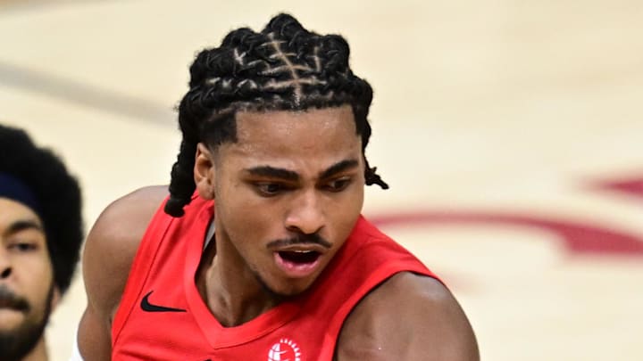 Toronto Raptors forward Collin Murray-Boyles grabs a rebound against Cleveland Cavaliers guard Sam Merrill.