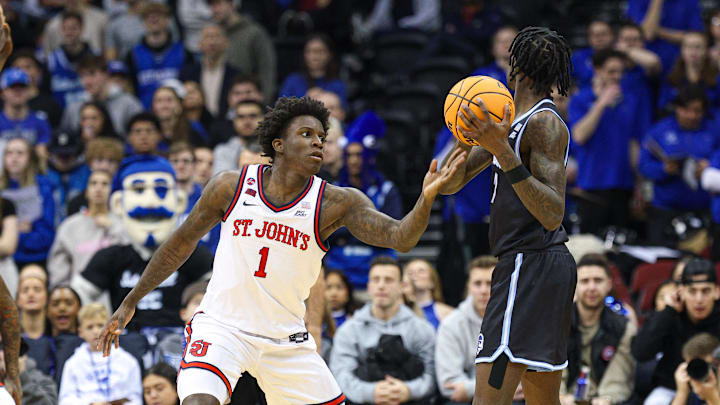 Jan 18, 2025; Newark, New Jersey, USA; St. John's basketball guard Kadary Richmond (1) defends Seton Hall Pirates forward Scotty Middleton (7) during the first half at Prudential Center. 