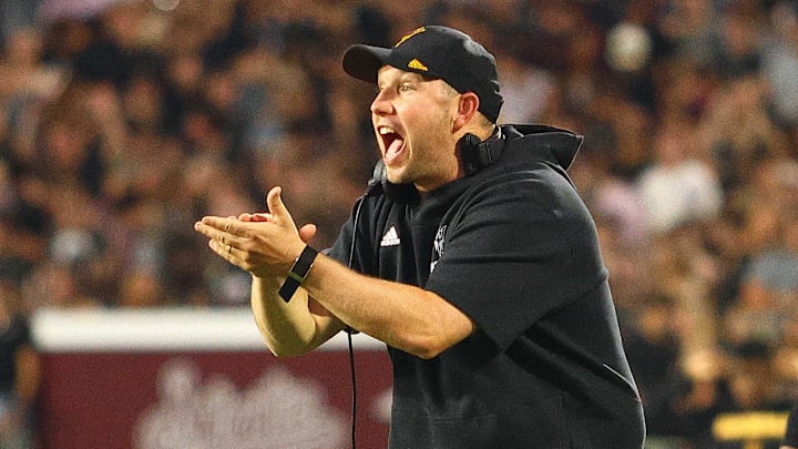 Sep 6, 2025; Starkville, Mississippi, USA; Arizona State Sun Devils head coach Kenny Dillingham reacts during the first quarter against the Mississippi State Bulldogs at Davis Wade Stadium at Scott Field. Mandatory Credit: Petre Thomas-Imagn Images Sep 6, 2025; Starkville, Mississippi, USA; Arizona State Sun Devils head coach Kenny Dillingham reacts during the first quarter against the Mississippi State Bulldogs at Davis Wade Stadium at Scott Field. Mandatory Credit: Petre Thomas-Imagn Images