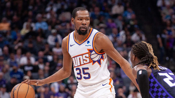 Apr 12, 2024; Sacramento, California, USA; Phoenix Suns forward Kevin Durant (35) controls the ball against Sacramento Kings guard Keon Ellis (23) during the second quarter at Golden 1 Center. Mandatory Credit: Ed Szczepanski-USA TODAY Sports Apr 12, 2024; Sacramento, California, USA; Phoenix Suns forward Kevin Durant (35) controls the ball against Sacramento Kings guard Keon Ellis (23) during the second quarter at Golden 1 Center. Mandatory Credit: Ed Szczepanski-USA TODAY Sports