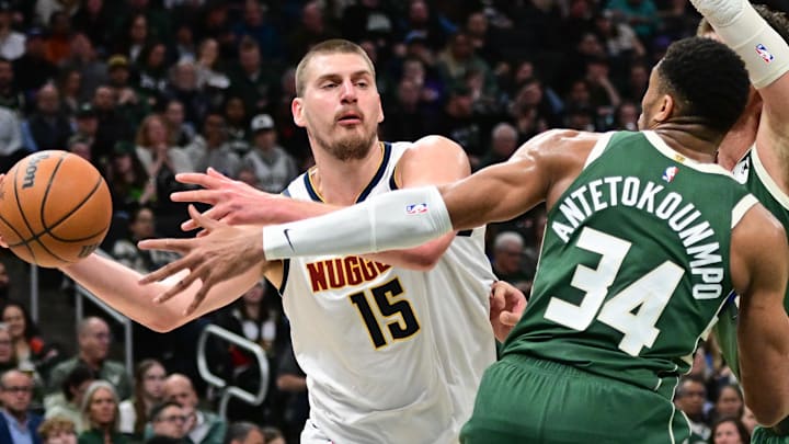Feb 27, 2025; Milwaukee, Wisconsin, USA; Denver Nuggets center Nikola Jokic (15) looks to pass the ball away from Milwaukee Bucks forward Giannis Antetokounmpo (34) in the third quarter at Fiserv Forum. Feb 27, 2025; Milwaukee, Wisconsin, USA; Denver Nuggets center Nikola Jokic (15) looks to pass the ball away from Milwaukee Bucks forward Giannis Antetokounmpo (34) in the third quarter at Fiserv Forum.