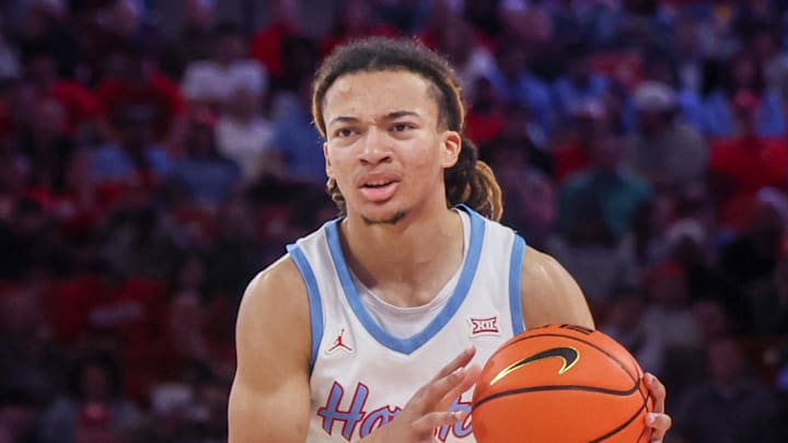 Jan 13, 2026; Houston, Texas, USA; Houston Cougars guard Kingston Flemings (4) dribbles against the West Virginia Mountaineers in the second half at Fertitta Center. Mandatory Credit: Thomas Shea-Imagn Images