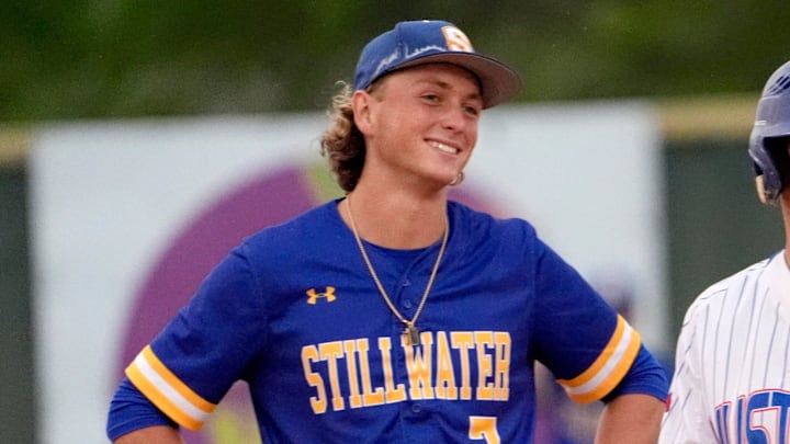 Fort Cobb-Broxton's Eli Willits talks with Stillwater's Ethan Holliday during the high school baseball game between Fort Cobb-Broxton and Stillwater at Edmond Santa Fe High School in Edmond, Okla., Friday, April, 18, 2025.