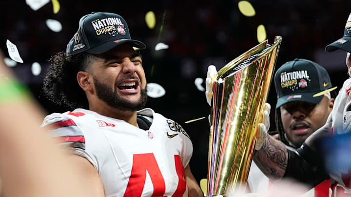 Ohio State Buckeyes defensive end JT Tuimoloau (44) celebrates after defeating Notre Dame Fighting Irish in the College Football Playoff championship game at Mercedes-Benz Stadium in Atlanta on Jan. 21, 2025. Ohio State Buckeyes defensive end JT Tuimoloau (44) celebrates after defeating Notre Dame Fighting Irish in the College Football Playoff championship game at Mercedes-Benz Stadium in Atlanta on Jan. 21, 2025.