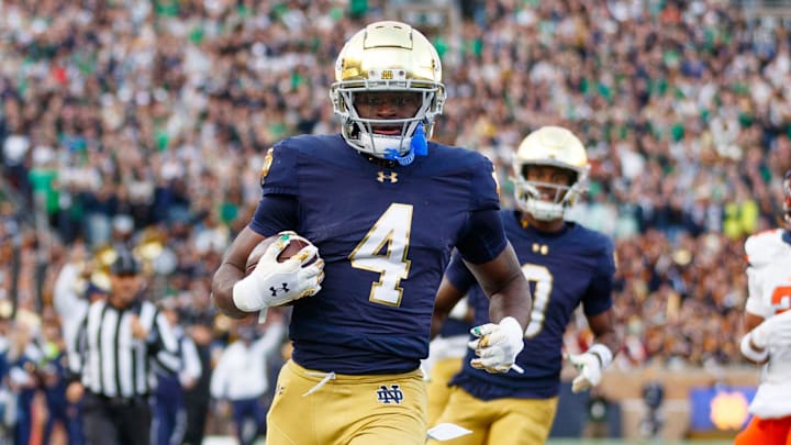 Notre Dame running back Jeremiyah Love (4) runs the ball into the end zone for a touchdown in the first half of a NCAA football game against Syracuse at Notre Dame Stadium on Saturday, Nov. 22, 2025, in South Bend.