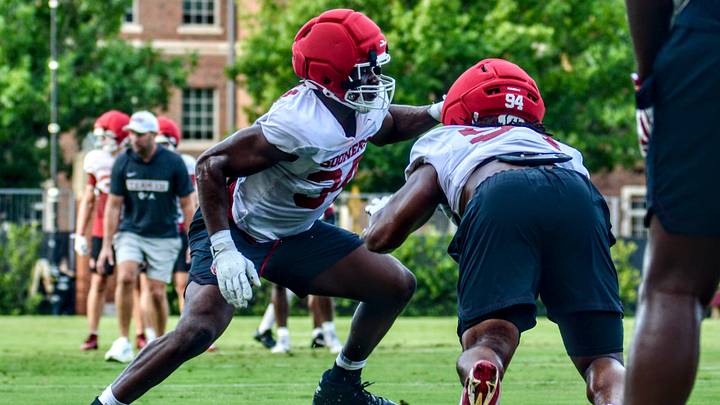 Oklahoma defensive end Adepoju Adebawore participates in a drill at practice. Oklahoma defensive end Adepoju Adebawore participates in a drill at practice.