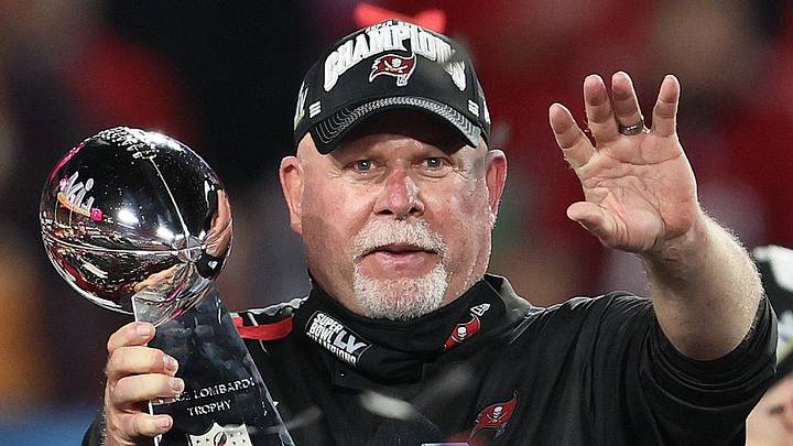 Feb 7, 2021; Tampa, FL, USA; Tampa Bay Buccaneers head coach Bruce Arians hoists the Vince Lombardi Trophy after defeating the Kansas City Chiefs in Super Bowl LV at Raymond James Stadium. Mandatory Credit: Matthew Emmons-Imagn Images
