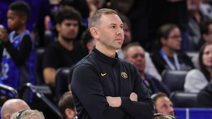 Dec 27, 2025; Orlando, Florida, USA; Denver Nuggets head coach David Adelman looks on during the second quarter against the Orlando Magic at Kia Center.