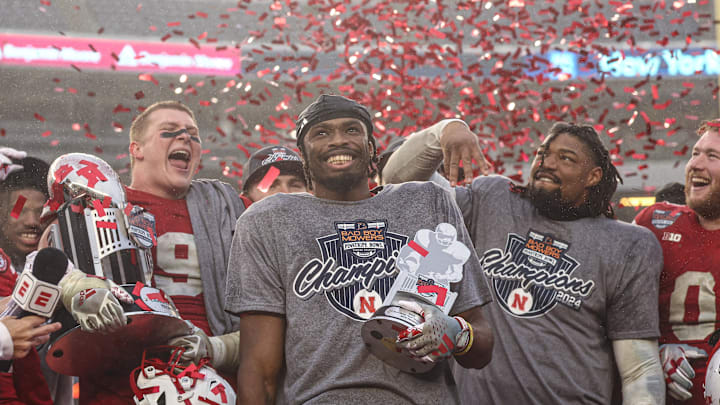 Nebraska running back Rahmir Johnson holds the MVP trophy and celebrates with teammates the Huskers' Pinstripe Bowl win against Boston College. Nebraska running back Rahmir Johnson holds the MVP trophy and celebrates with teammates the Huskers' Pinstripe Bowl win against Boston College.
