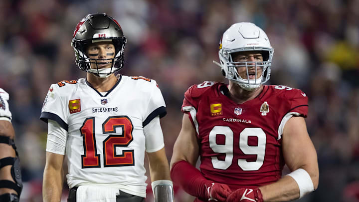 Tampa Bay Buccaneers quarterback Tom Brady alongside Arizona Cardinals defensive end J.J. Watt.