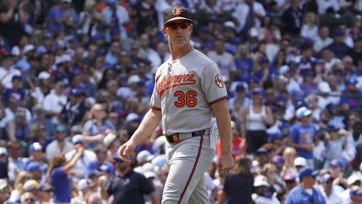 Aug 3, 2025; Chicago, Illinois, USA; Baltimore Orioles interim manager Tony Mansolino (36) makes a pitching change against the Chicago Cubs during the fifth inning at Wrigley Field. 