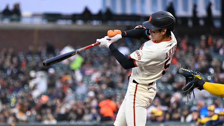 Apr 23, 2025; San Francisco, California, USA; San Francisco Giants center fielder Jung Hoo Lee (51) hits a single against the Milwaukee Brewers in the first inning at Oracle Park. 