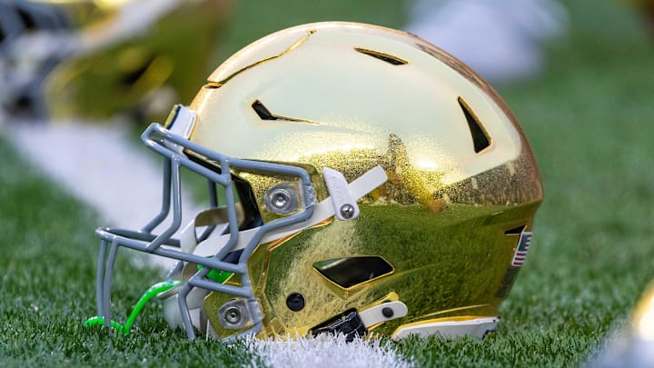 Sep 13, 2025; South Bend, Indiana, USA; A gold Notre Dame Fighting Irish helmet on the field before a game against the Texas A&M Aggies at Notre Dame Stadium. Mandatory Credit: Michael Caterina-Imagn Images Sep 13, 2025; South Bend, Indiana, USA; A gold Notre Dame Fighting Irish helmet on the field before a game against the Texas A&M Aggies at Notre Dame Stadium. Mandatory Credit: Michael Caterina-Imagn Images