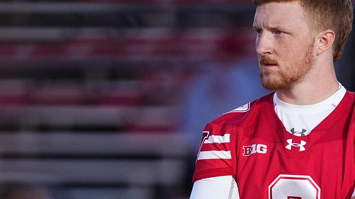 Oct 11, 2025; Madison, Wisconsin, USA; Wisconsin Badgers quarterback Billy Edwards Jr. (9) watches pre-game warmups at Camp Randall Stadium. Mandatory Credit: Ross Harried-Imagn Images