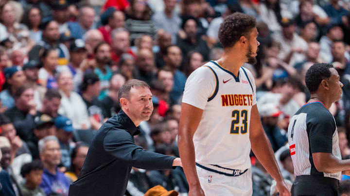 Oct 6, 2025; Vancouver, British Columbia, CAN; Denver Nuggets head coach David Adelman talks with forward Cameron Johnson (23) against the Toronto Raptors in the second half at Rogers Arena. Mandatory Credit: Bob Frid-Imagn Images