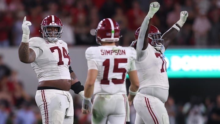 Sep 27, 2025; Athens, Georgia, USA; Alabama Crimson Tide offensive lineman Kadyn Proctor (74) celebrates with quarterback Ty Simpson (15) after defeating the Georgia Bulldogs at Sanford Stadium. Mandatory Credit: Brett Davis-Imagn Images