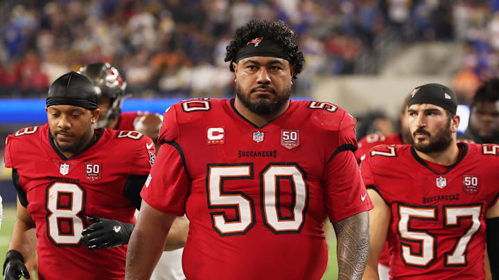 Tampa Bay Buccaneers defensive tackle Vita Vea (50) walks off the field during halftime with linebacker SirVocea Dennis (8), linebacker John Bullock (57) and safety Tykee Smith (23)