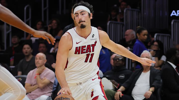 Oct 15, 2024; Miami, Florida, USA; Miami Heat guard Jaime Jaquez Jr. (11) drives to the basket against San Antonio Spurs center Charles Bassey (28) during the third quarter at Kaseya Center. Mandatory Credit: Sam Navarro-Imagn Images