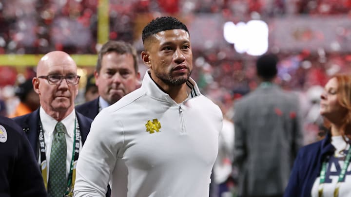 Jan 20, 2025; Atlanta, GA, USA; Notre Dame Fighting Irish head coach Marcus Freeman reacts after losing against the Ohio State Buckeyes in the CFP National Championship college football game at Mercedes-Benz Stadium. Jan 20, 2025; Atlanta, GA, USA; Notre Dame Fighting Irish head coach Marcus Freeman reacts after losing against the Ohio State Buckeyes in the CFP National Championship college football game at Mercedes-Benz Stadium.