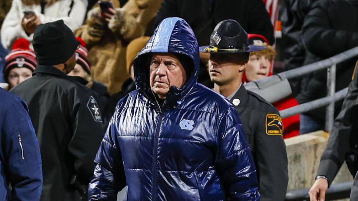 Nov 29, 2025; Raleigh, North Carolina, USA;  North Carolina Tar Heels head coach Bill Belichick takes to the field during the warmups of the game against NC State Wolfpack at Carter-Finley Stadium.  Mandatory Credit: Jaylynn Nash-Imagn Images