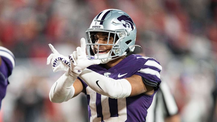 Dec 28, 2023; Orlando, FL, USA; Kansas State cornerback Jacob Parrish (10) celebrates an interception against NC State in the fourth quarter at Camping World Stadium. Mandatory Credit: Jeremy Reper-Imagn Images