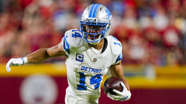Oct 12, 2025; Kansas City, Missouri, USA; Detroit Lions wide receiver Amon-Ra St. Brown (14) runs with the ball during the first half against the Kansas City Chiefs at GEHA Field at Arrowhead Stadium. Mandatory Credit: Jay Biggerstaff-Imagn Images