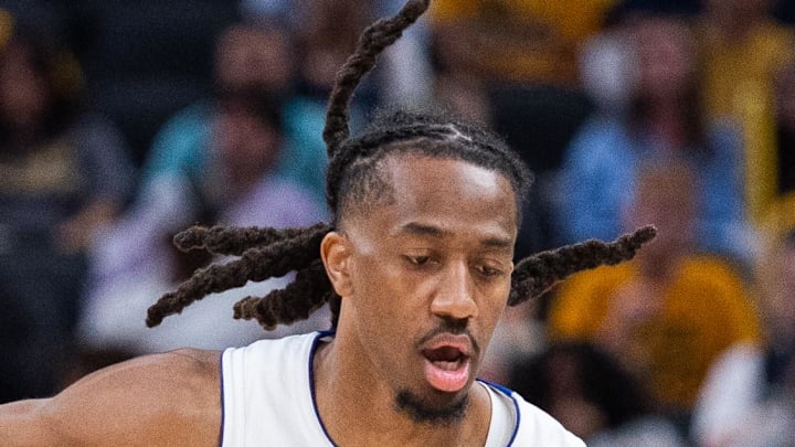 Detroit Pistons guard Daniss Jenkins (24) dribbles the ball while Indiana Pacers guard Taelon Peter (4) defends in the second half at Gainbridge Fieldhouse on Apr 12, 2026.