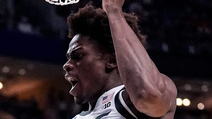 Michigan State forward Coen Carr (55) dunks against Louisville during the second half of NCAA Tournament Second Round at KeyBank Center in Buffalo on Saturday, March 21, 2026. Michigan State forward Coen Carr (55) dunks against Louisville during the second half of NCAA Tournament Second Round at KeyBank Center in Buffalo on Saturday, March 21, 2026.