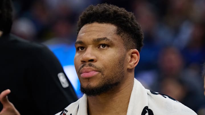 Milwaukee Bucks forward Giannis Antetokounmpo (34) looks on from the bench against the Golden State Warriors during the second quarter at Chase Center on January 7, 2026.
