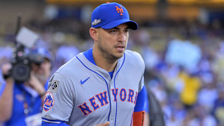Oct 13, 2024; Los Angeles, California, USA; New York Mets second base Jose Iglesias (11) takes the field before game one of the NLCS for the 2024 MLB Playoffs at Dodger Stadium