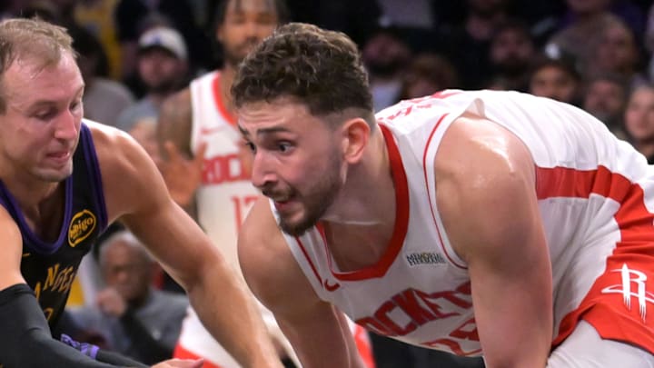 Apr 21, 2026; Los Angeles, California, USA; Los Angeles Lakers guard Luke Kennard (10) defends Houston Rockets center Alperen Sengun (28) after a reoubnd during the second half of game two of the first round of the 2026 NBA Playoffs at Crypto.com Arena. Mandatory Credit: Jayne Kamin-Oncea-Imagn Images