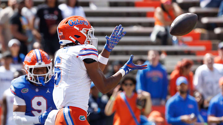 Apr 12, 2025; Gainesville, FL, USA; Florida Gators wide receiver Dallas Wilson (6) catches a pass for a touchdown over Florida Gators defensive back Drake Stubbs (9) during the second half at Ben Hill Griffin Stadium. Mandatory Credit: Matt Pendleton-Imagn Images Apr 12, 2025; Gainesville, FL, USA; Florida Gators wide receiver Dallas Wilson (6) catches a pass for a touchdown over Florida Gators defensive back Drake Stubbs (9) during the second half at Ben Hill Griffin Stadium. Mandatory Credit: Matt Pendleton-Imagn Images