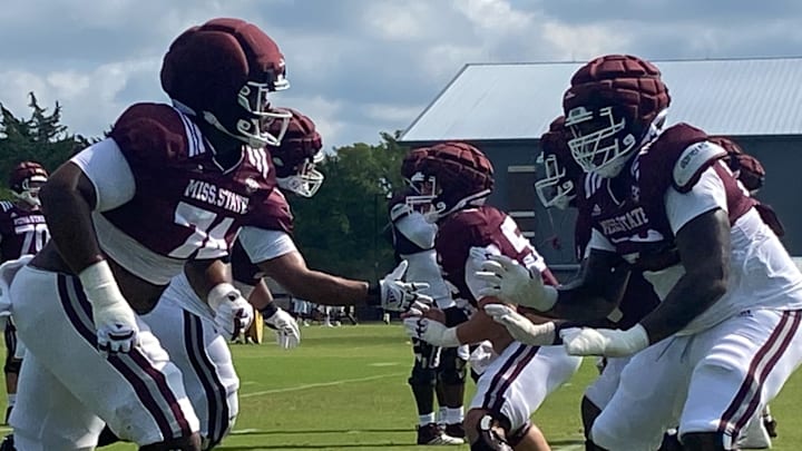 Mississippi State offensive linemen go through a drill during Friday morning's practice in Starkville, Miss.