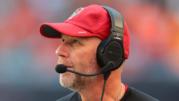 Nov 15, 2025; Miami Gardens, Florida, USA; NC State Wolfpack head coach Dave Doeren watches from the sideline against the Miami Hurricanes during the second quarter at Hard Rock Stadium. Mandatory Credit: Sam Navarro-Imagn Images