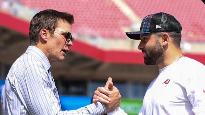 Fox NFL broadcaster and former NFL quarterback Tom Brady speaks to Tampa Bay Buccaneers quarterback Baker Mayfield (6) 