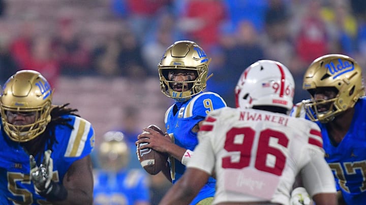 Nov 8, 2025; Pasadena, California, USA; UCLA Bruins quarterback Nico Iamaleava (9) drops back to pass against the Nebraska Cornhuskers during the second half at the Rose Bowl. Mandatory Credit: Gary A. Vasquez-Imagn Images