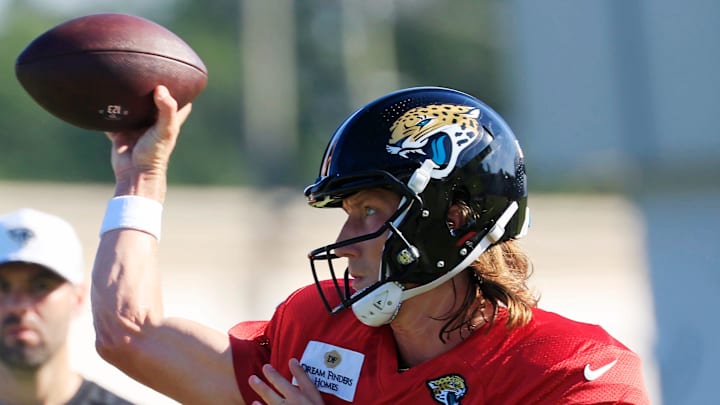Jacksonville Jaguars quarterback Trevor Lawrence (16) throws the ball as quaterbacks coach Spencer Whipple looks on during an NFL training camp session at the Miller Electric Center, Tuesday, July 29, 2025, in Jacksonville, Fla. [Corey Perrine/Florida Times-Union]