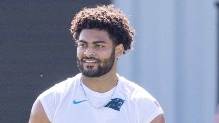 Carolina Panthers tight end Tommy Tremble works out on the sidelines during training camp. 