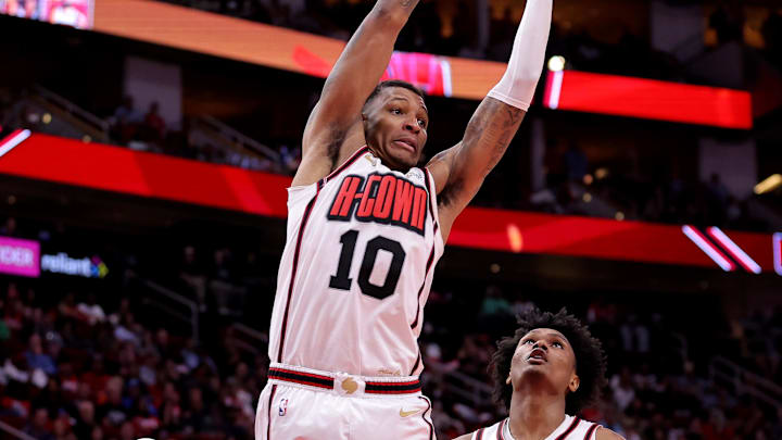Apr 4, 2025; Houston, Texas, USA; Houston Rockets forward Jabari Smith Jr (10) rebounds against the Oklahoma City Thunder during the fourth quarter at Toyota Center. Mandatory Credit: Erik Williams-Imagn Images