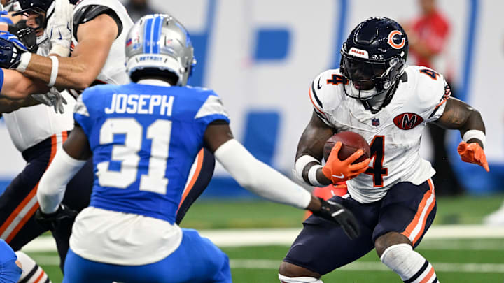 Chicago Bears running back D'Andre Swift (4) carries the ball defended by Detroit Lions safety Kerby Joseph (31)